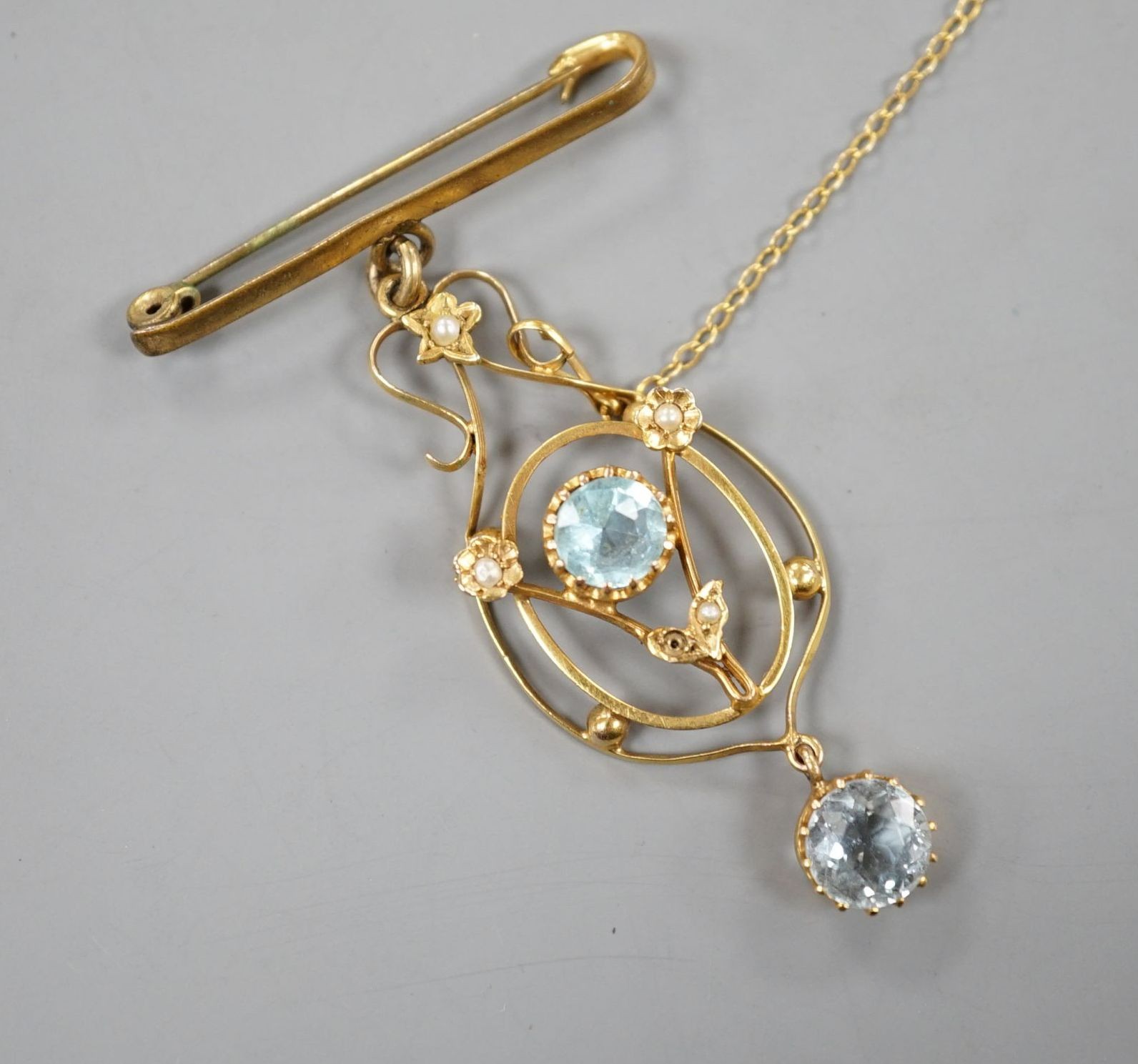 An early 20th century 9c, gem and seed pearl set drop pendant, now with bar brooch suspension, pendant 47mm (stone loose)
